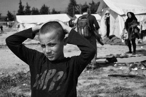 EU-refugees-detention-center-boy-in-Idomeni