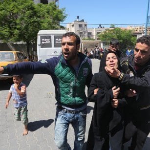 20160507_A-Gazan-women-reacts-after-her-children-are-killed-in-a-fire-in-Gaza