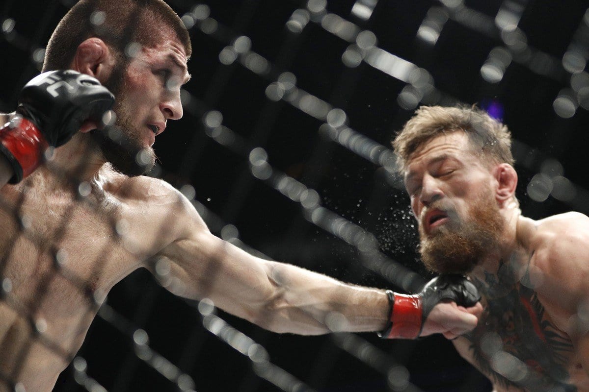Khabib Nurmagomedov, left, punches Conor McGregor during a lightweight title mixed martial arts bout at UFC 229 in Las Vegas. Photo: AP Photo